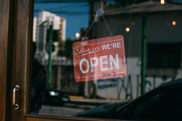 Business open sign covered by marital settlement agreement.