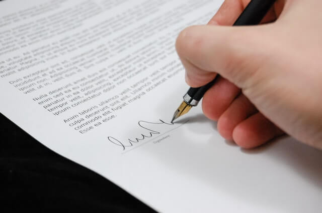 Signing papers for divorce without a lawyer.