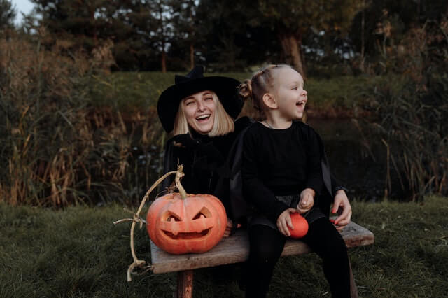 A mother and child in halloween costumes talk about the fear of divorce.