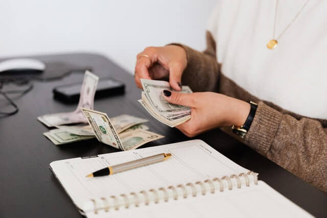 Woman counting florida child support money